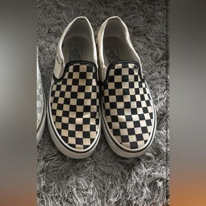 Black and white checkered board vans.